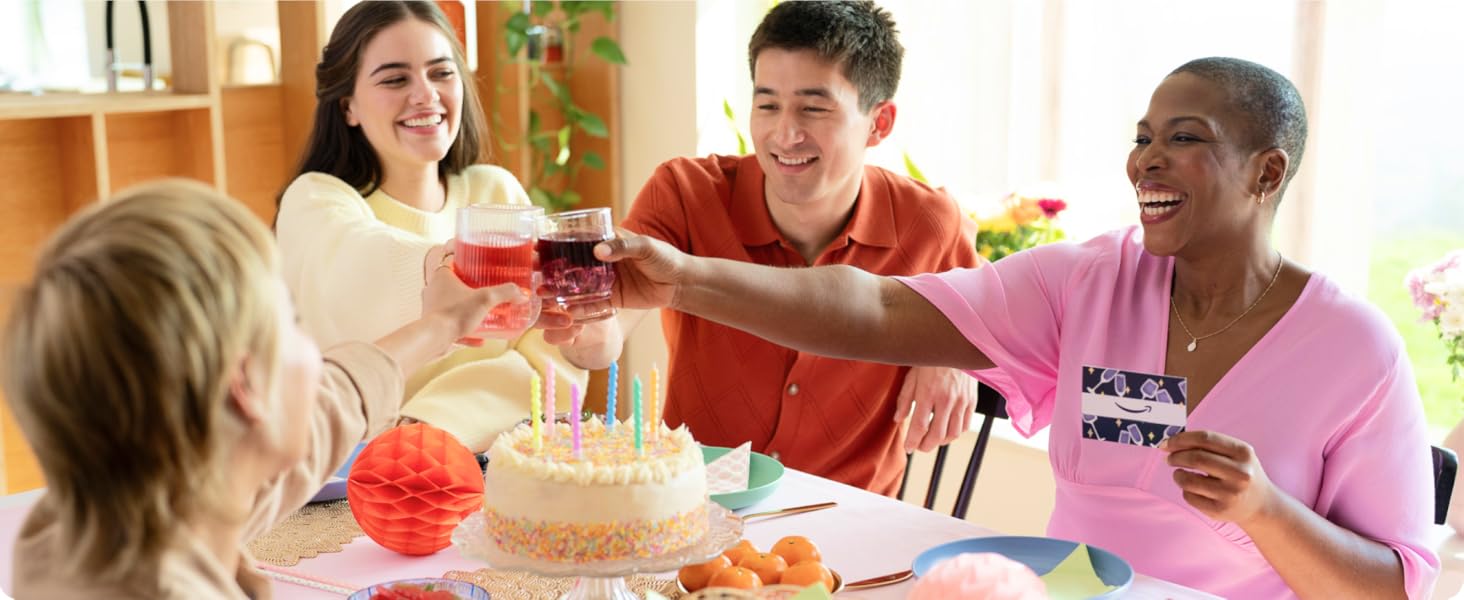 People celebrating a sepcial occasion with cake, drinks and an Amazon gift card