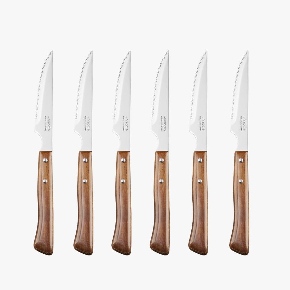 Arcos Steak Knives Set of 6 in Stainless Steel. Meat Knife Pack with Pearl Edge for Cutting and Fillet. Serrated Blade and Beech Wood Handle. Series Mesa